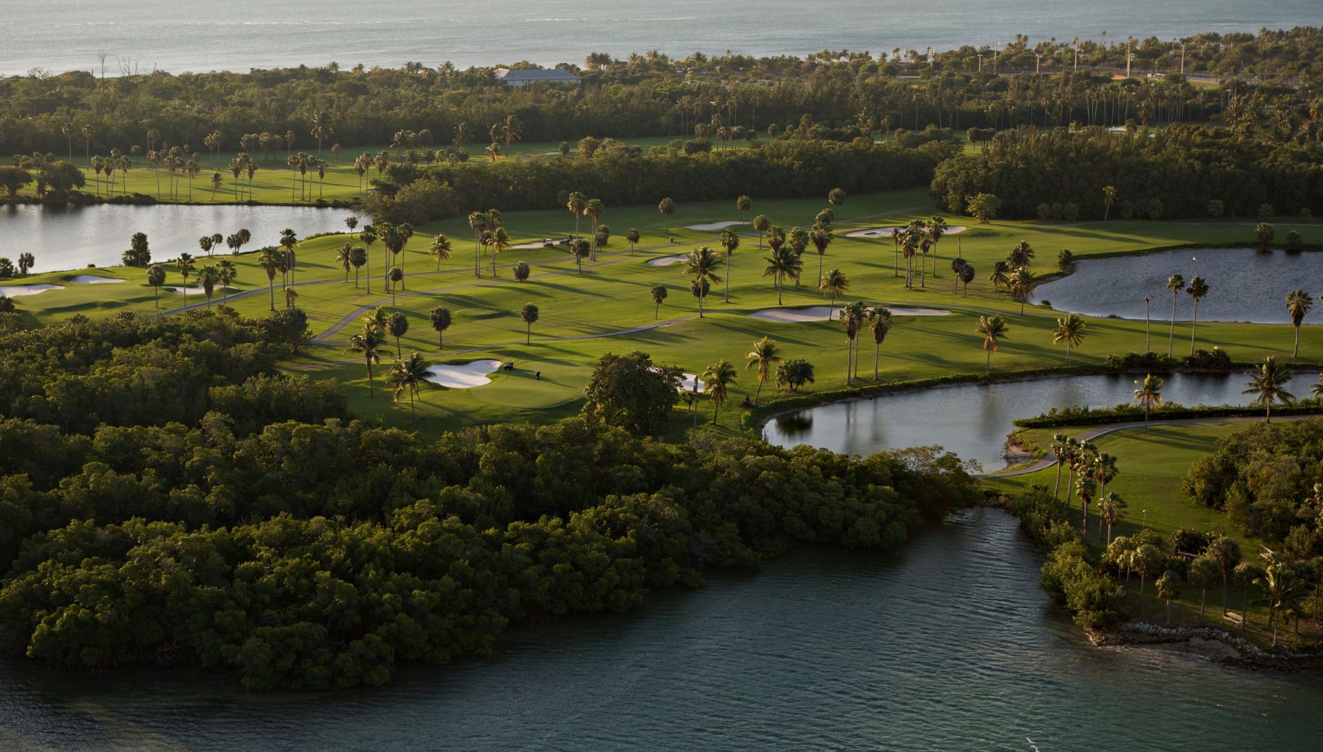 A drone aerial view of a few of the Crandon Golf at Key Biscane's greens.